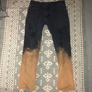 Distressed black and brown jeans